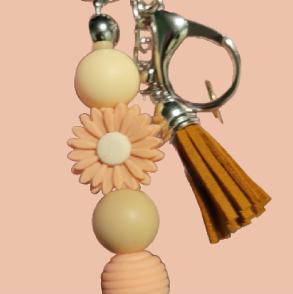 Yellow and tan daisy keychain with tassel